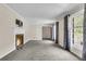 Bright living room featuring a fireplace and large windows at 598 Maple Branch Rd, Reevesville, SC 29471