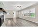 Spacious living room featuring a fireplace and wood-look flooring at 598 Maple Branch Rd, Reevesville, SC 29471