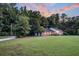 Brick house with large yard and wooded backdrop at 598 Maple Branch Rd, Reevesville, SC 29471
