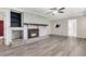 Whitewashed brick fireplace with wood mantel in the living room at 598 Maple Branch Rd, Reevesville, SC 29471