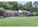 Brick ranch house with covered porch and large lawn at 598 Maple Branch Rd, Reevesville, SC 29471