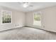 Well-lit bedroom with neutral walls, carpet, and large windows at 598 Maple Branch Rd, Reevesville, SC 29471