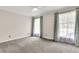 Spacious bedroom with neutral walls, carpet, and ample natural light at 598 Maple Branch Rd, Reevesville, SC 29471