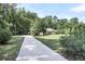 Long driveway leading to a ranch house at 598 Maple Branch Rd, Reevesville, SC 29471