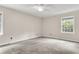 Bright bedroom with neutral walls, carpet, and large windows at 598 Maple Branch Rd, Reevesville, SC 29471