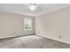 Cozy bedroom with neutral walls, carpet, and a window at 598 Maple Branch Rd, Reevesville, SC 29471
