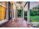Brick front porch with terracotta tile flooring at 598 Maple Branch Rd, Reevesville, SC 29471