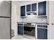 Modern kitchen with dark blue cabinets and granite counters at 598 Maple Branch Rd, Reevesville, SC 29471