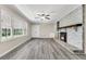 Living area showcasing a fireplace and large windows at 598 Maple Branch Rd, Reevesville, SC 29471