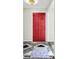 Inviting entryway with red front door and geometric tile floor at 598 Maple Branch Rd, Reevesville, SC 29471
