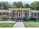 Covered front porch with brick flooring and columns at 598 Maple Branch Rd, Reevesville, SC 29471