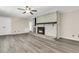 Living room with fireplace, wood-look floors, and ceiling fan at 598 Maple Branch Rd, Reevesville, SC 29471