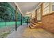 Brick patio with steps leading to the backyard and a view of the fenced yard at 598 Maple Branch Rd, Reevesville, SC 29471