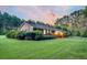 Brick house exterior with well-maintained landscaping and a fenced yard at 598 Maple Branch Rd, Reevesville, SC 29471