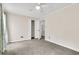 Bright bedroom featuring neutral walls, carpet flooring, and a large closet at 598 Maple Branch Rd, Reevesville, SC 29471