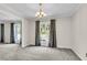 Dining room with chandelier and view to the kitchen at 598 Maple Branch Rd, Reevesville, SC 29471