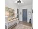 Elegant entryway with console table, rug, and gray accent door at 301 Longshore St # 423, Charleston, SC 29492