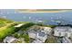 Aerial view of waterfront community with upscale homes, marina, and bridge at 301 Longshore St # 423, Charleston, SC 29492