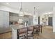 Modern kitchen with gray cabinets, island with seating, and stainless steel appliances at 301 Longshore St # 423, Charleston, SC 29492