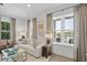 Bright and airy living room with large windows, comfortable seating, and hardwood floors at 301 Longshore St # 423, Charleston, SC 29492