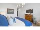 Serene bedroom with a king-size bed, dresser, and TV at 301 Longshore St # 423, Charleston, SC 29492