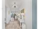 Bright entryway with console table, rug, and view into the living area at 301 Longshore St # 423, Charleston, SC 29492