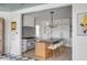 White kitchen with blue stove, statement tile backsplash, and gold accents at 228 Haddrell St, Mount Pleasant, SC 29464