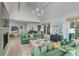 Elegant living room with green sofas, high ceilings, and hardwood floors at 228 Haddrell St, Mount Pleasant, SC 29464