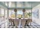 Elegant dining room with a stunning view and checkerboard floors at 228 Haddrell St, Mount Pleasant, SC 29464