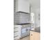 Blue La Cornue range is the focal point of this white kitchen at 228 Haddrell St, Mount Pleasant, SC 29464