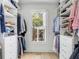 Well-organized walk-in closet with custom shelving and drawers at 228 Haddrell St, Mount Pleasant, SC 29464