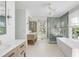 Elegant bathroom featuring a freestanding tub, walk-in shower, and dual vanities at 228 Haddrell St, Mount Pleasant, SC 29464