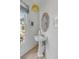 Powder room with pedestal sink and round mirror at 228 Haddrell St, Mount Pleasant, SC 29464