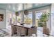 Charming dining area with a wooden table, chairs, and a view of the water at 228 Haddrell St, Mount Pleasant, SC 29464