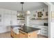 Kitchen features a large island with a marble countertop and a farmhouse sink at 228 Haddrell St, Mount Pleasant, SC 29464