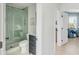 Small bathroom with a walk-in shower and dark gray vanity at 228 Haddrell St, Mount Pleasant, SC 29464