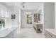 Bright bathroom with a freestanding tub, walk-in shower, and modern vanity at 228 Haddrell St, Mount Pleasant, SC 29464