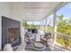 Spacious porch with water views, comfortable seating, and a fireplace at 228 Haddrell St, Mount Pleasant, SC 29464