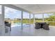 White pool deck with seating area and a view of the marsh at 228 Haddrell St, Mount Pleasant, SC 29464
