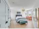 Cozy bedroom with light wood floors, a comfortable bed and built-in closet at 228 Haddrell St, Mount Pleasant, SC 29464