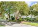 Long driveway leading to a charming white house at 228 Haddrell St, Mount Pleasant, SC 29464