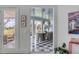 Sunlit dining area with checkerboard floor and French doors leading to a deck at 228 Haddrell St, Mount Pleasant, SC 29464
