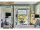 Bedroom with home gym and access to a balcony overlooking the water at 228 Haddrell St, Mount Pleasant, SC 29464
