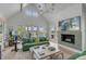 Spacious living area with hardwood floors, green sofas, and a fireplace at 228 Haddrell St, Mount Pleasant, SC 29464