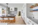 Modern kitchen with a large island, white cabinets, and a farmhouse sink at 228 Haddrell St, Mount Pleasant, SC 29464