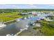Aerial view of waterfront community with boats and marsh at 228 Haddrell St, Mount Pleasant, SC 29464