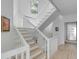 Bright, modern staircase with white railings and light hardwood floors at 228 Haddrell St, Mount Pleasant, SC 29464
