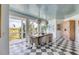 Bright dining room with a light-colored wood table and checkerboard floors at 228 Haddrell St, Mount Pleasant, SC 29464