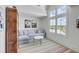 Light-filled sitting room with a comfortable couch and water views at 228 Haddrell St, Mount Pleasant, SC 29464