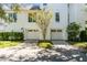 Two-car garage with ample space and landscaping at 228 Haddrell St, Mount Pleasant, SC 29464